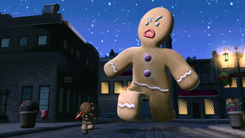 A giant gingerbread man stomps down a village street at night